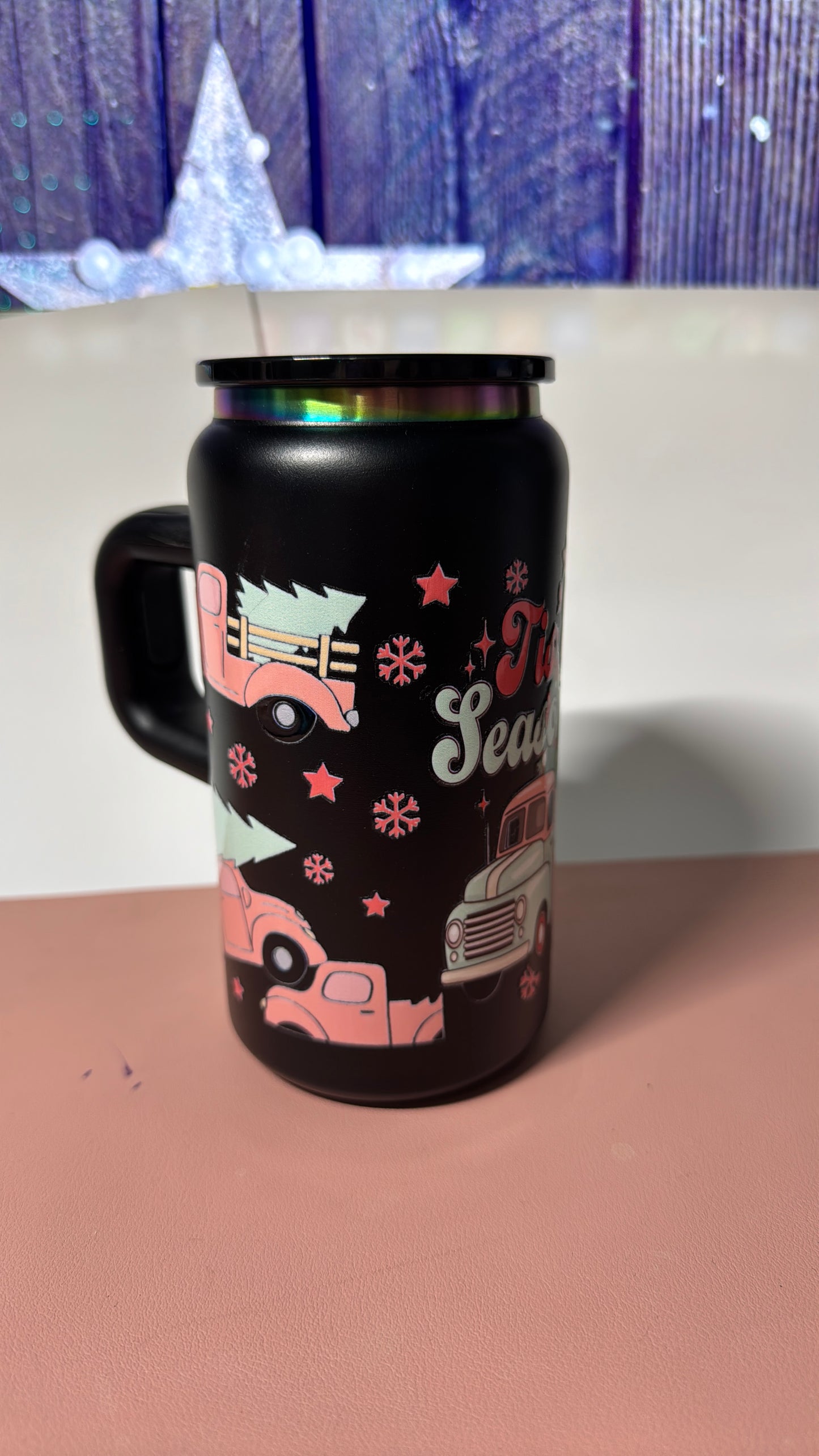 Christmas pink design on a black stainless steel can cup.