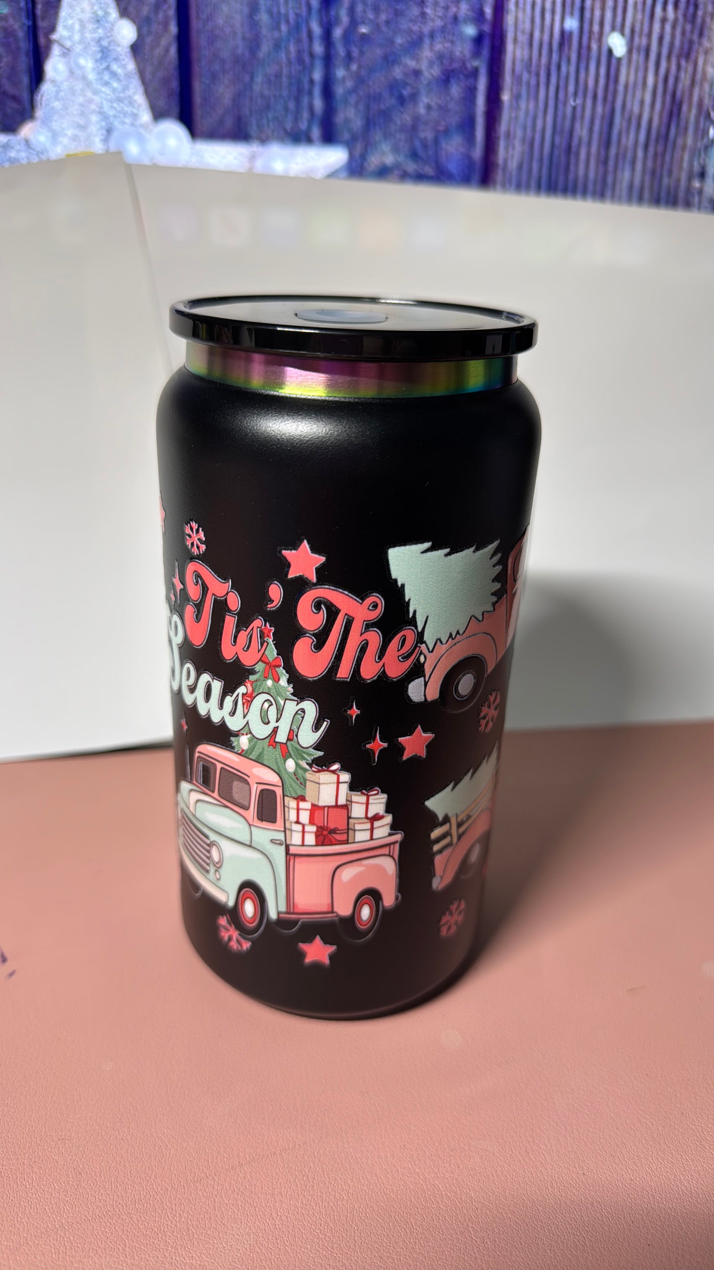 Christmas pink design on a black stainless steel can cup.