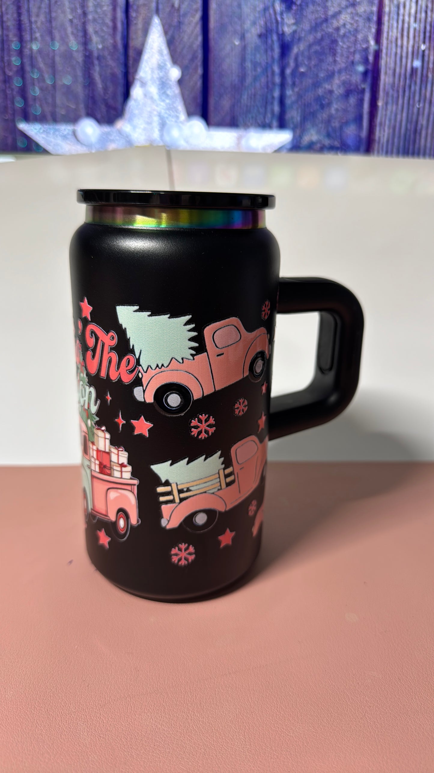 Christmas pink design on a black stainless steel can cup.