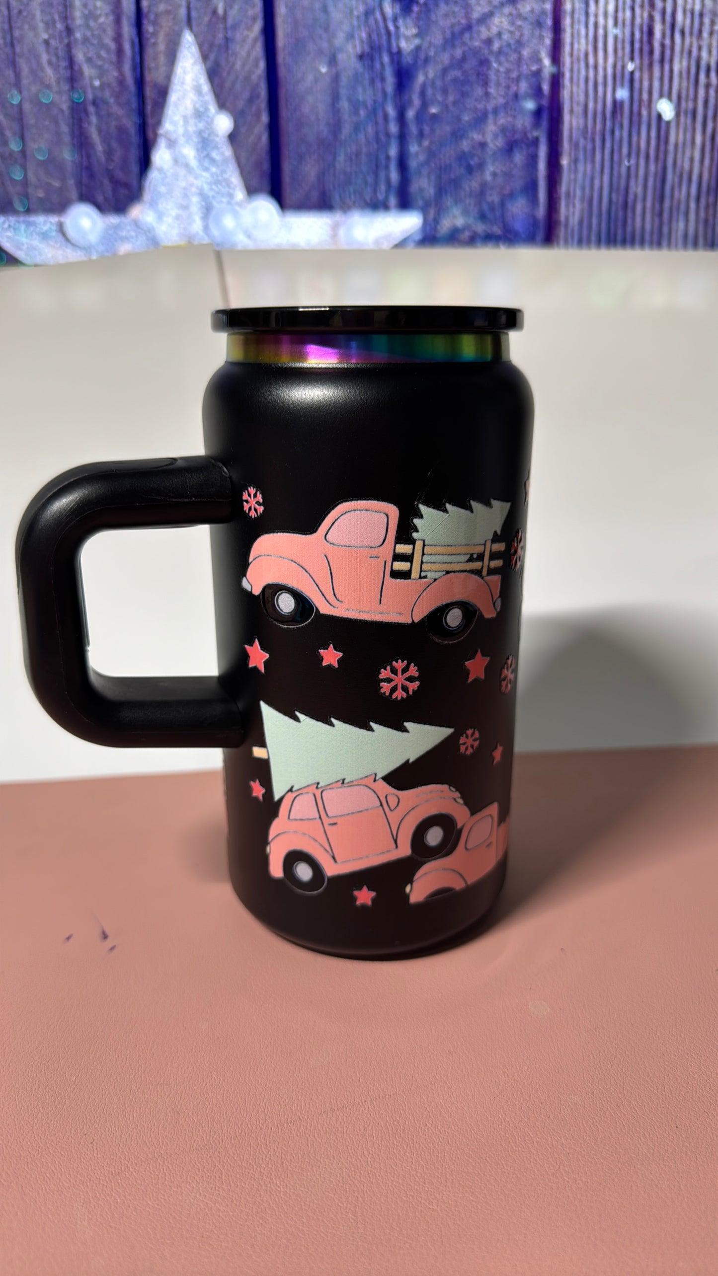 Christmas pink design on a black stainless steel can cup.