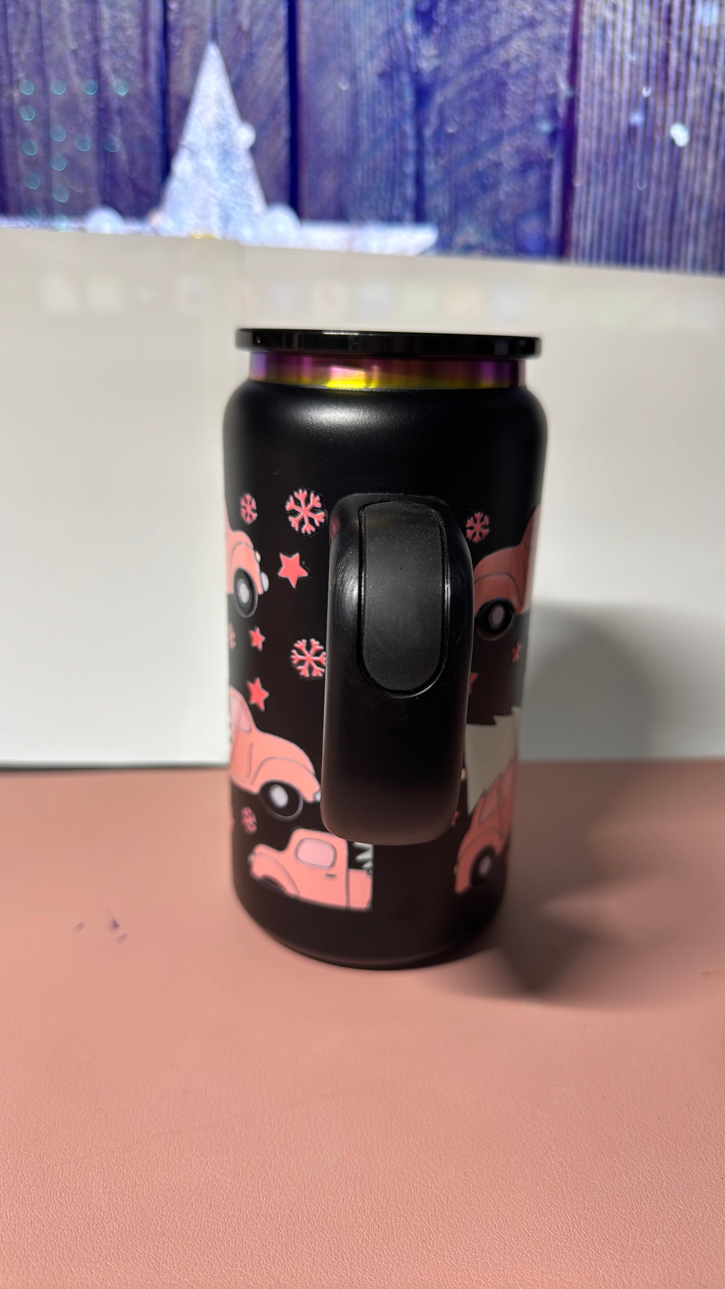 Christmas pink design on a black stainless steel can cup.