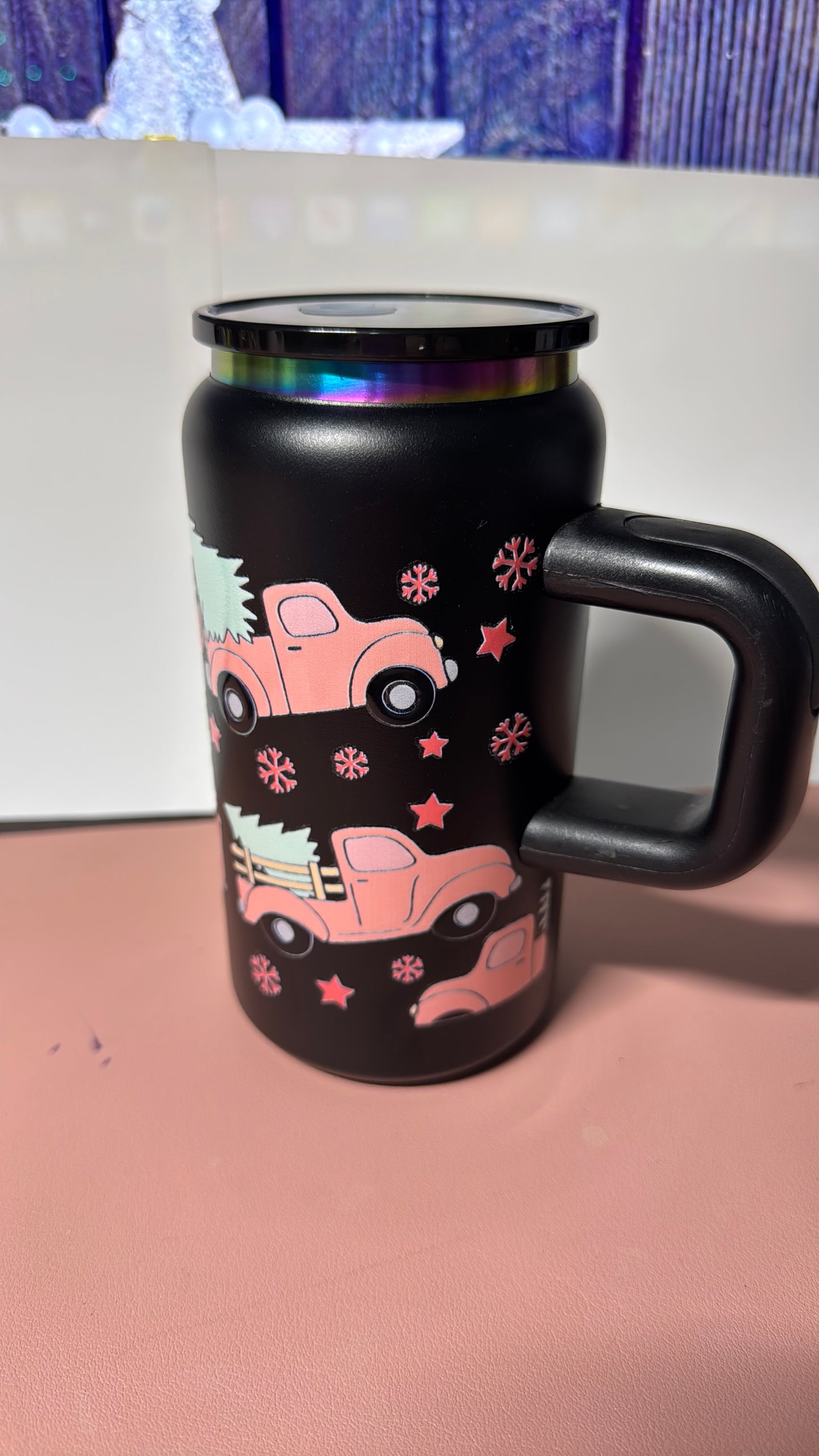 Christmas pink design on a black stainless steel can cup.